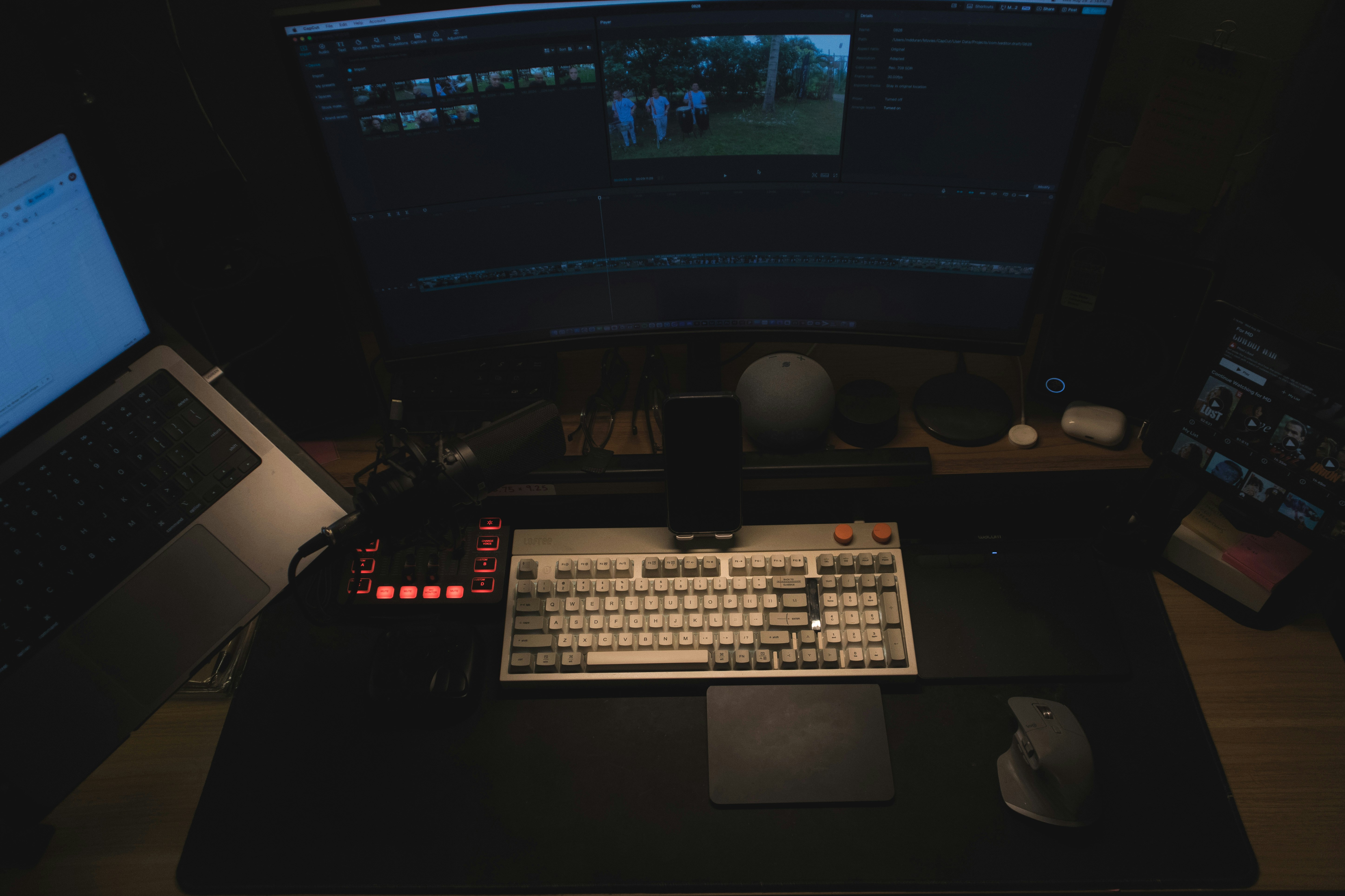 Digital production workspace with multiple monitors and editing setup